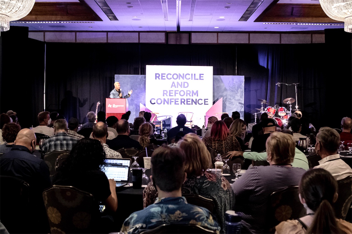 A full ballroom of attendees listening to a speaker at the 2021 Reconcile and Reform Conference in Phoenix