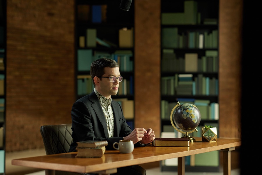 Matthew Vines on the library set during filming