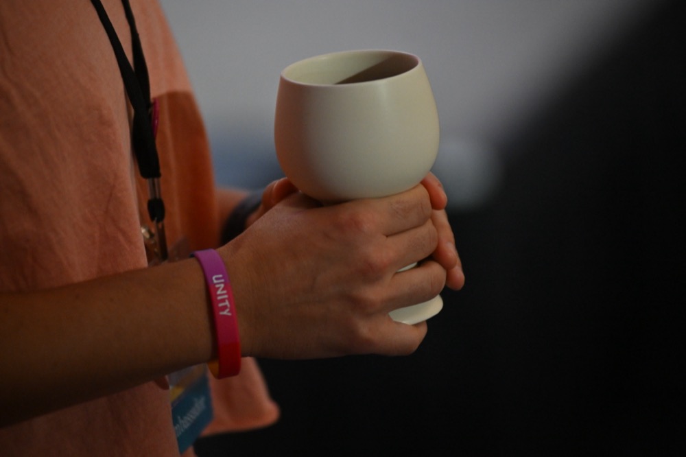 Hands holding a communion cup