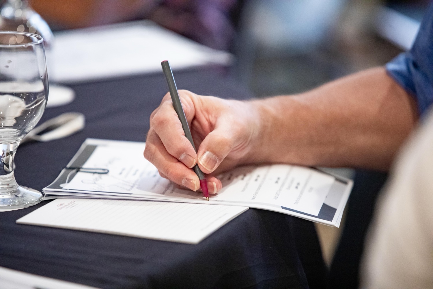A parent taking notes during a session